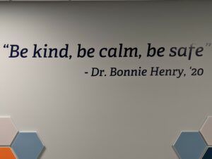 Statement "Be kind, be calm, be safe" painted on the wall