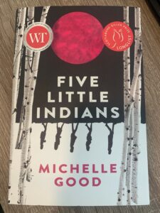 The photo depicts the cover of the book by Michelle Good titled Five Little Indians